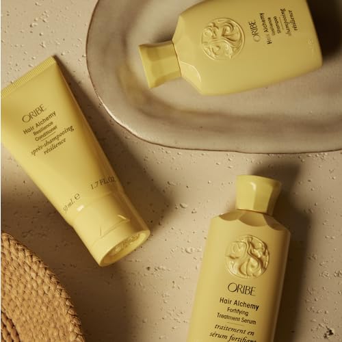 Oribe Hair Alchemy lifestyle shot suggests salon-worthy results at home.
