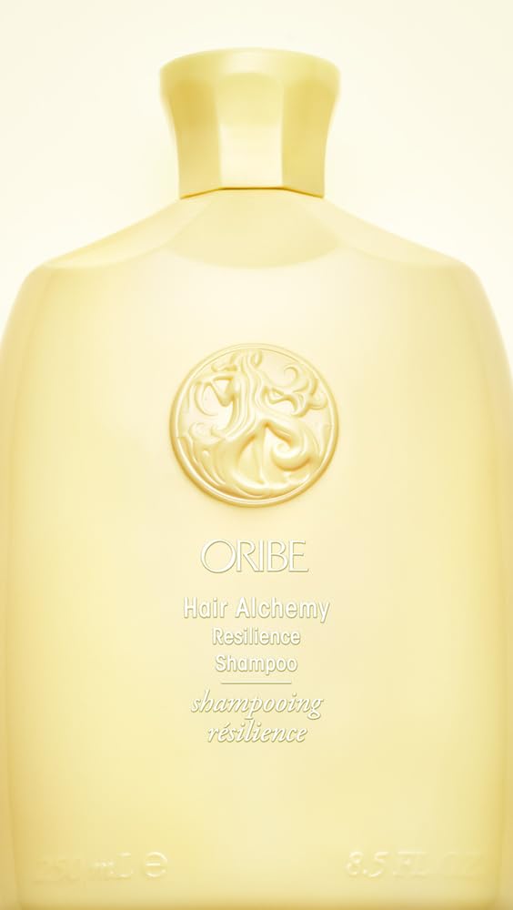 Oribe Hair Alchemy Resilience Shampoo bottle with gold cap conveys luxury for fragile hair.
