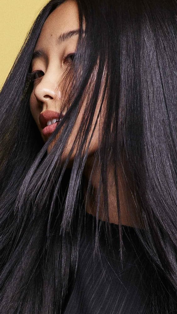 Oribe Hair Alchemy Resilience Shampoo featuring chia seed and bamboo leaf infusion.