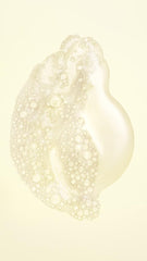 Oribe Hair Alchemy Resilience Shampoo lather close-up shows nourishing, strand-strengthening formula.