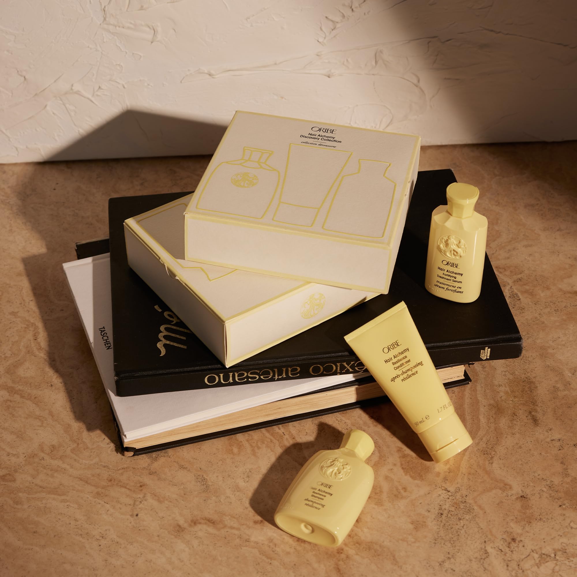 Oribe Hair Alchemy Serum application drops show a quick fortification routine.