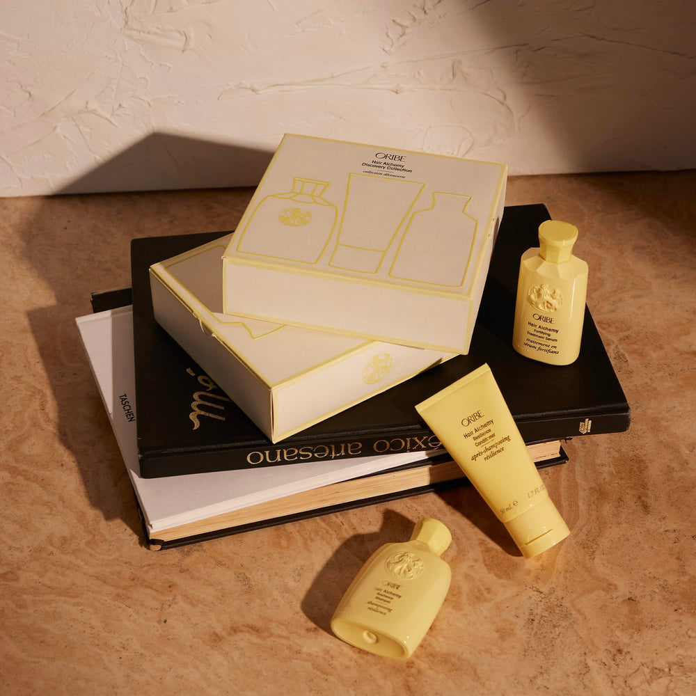 Oribe Hair Alchemy Serum application drops show a quick fortification routine.