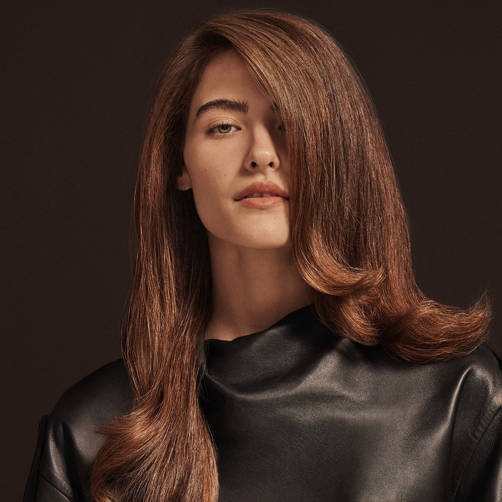 Vegan and cruelty-free icon beside Oribe Imperial Blowout packaging