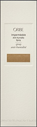 Oribe Impermeable Anti-Humidity Spray mist in hand ready to define texture
