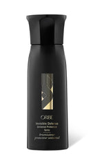 Oribe Invisible Defense bottle front with a lightweight heat protection mist