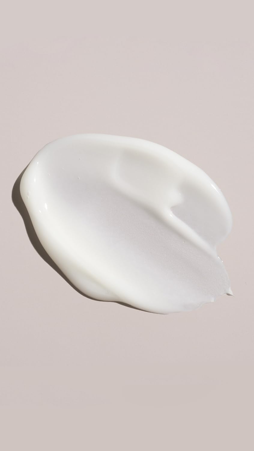 Oribe Magnificent Volume cream texture close-up for light conditioning