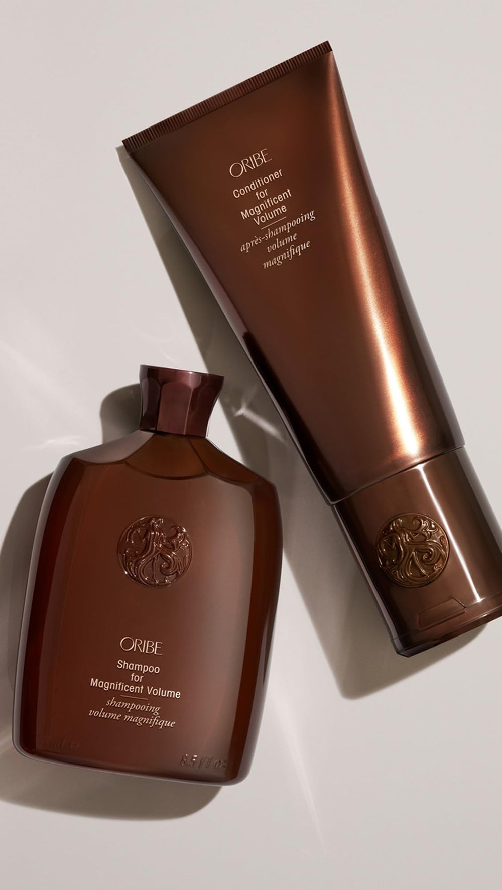Oribe Magnificent Volume model with voluminous shiny hair after use