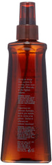 Oribe Maximista mist on hair demonstrating volume and body