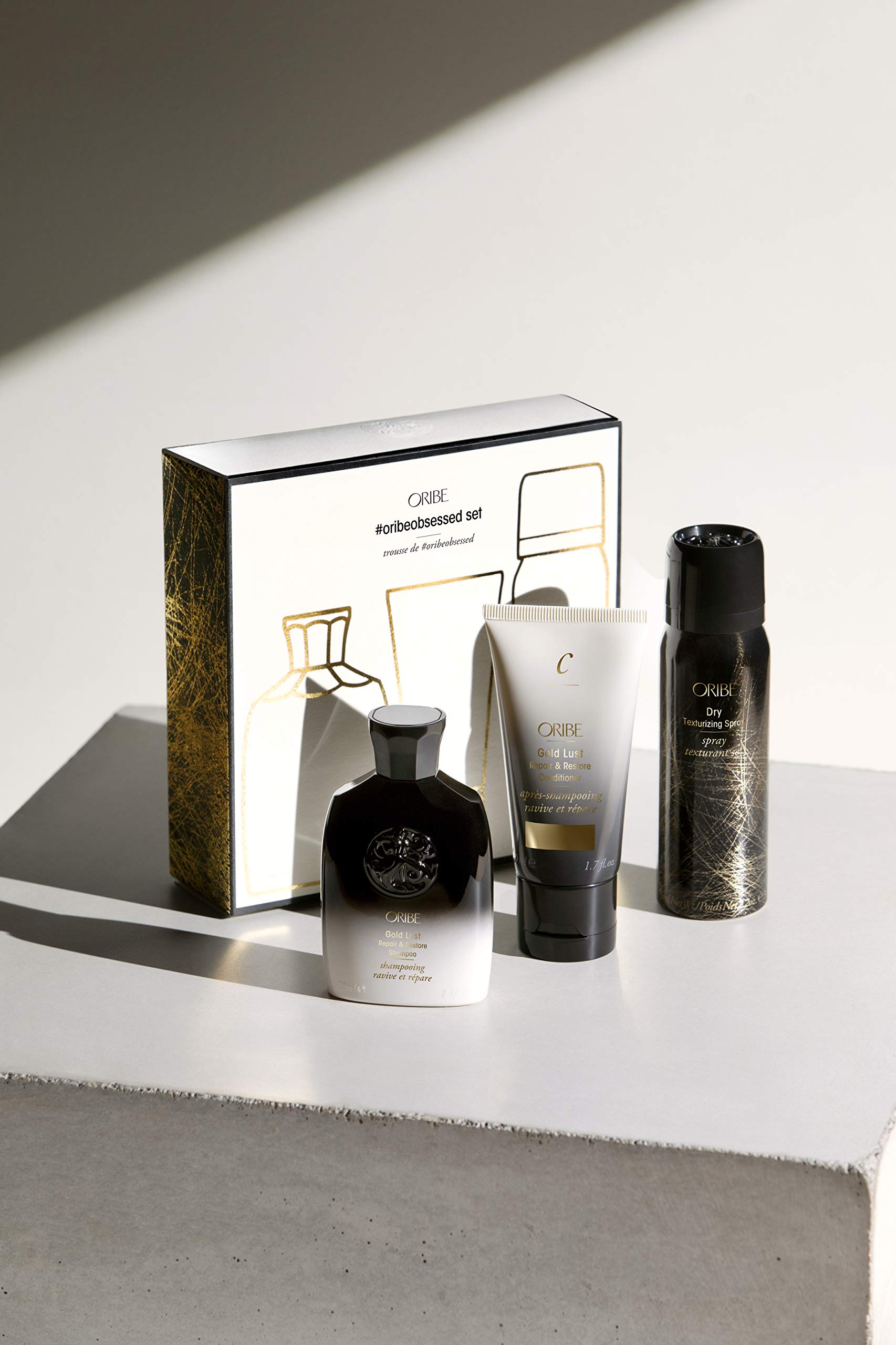 Oribe Obsessed Set conditioner bottle delivering soft, detangled, moisture-rich hair