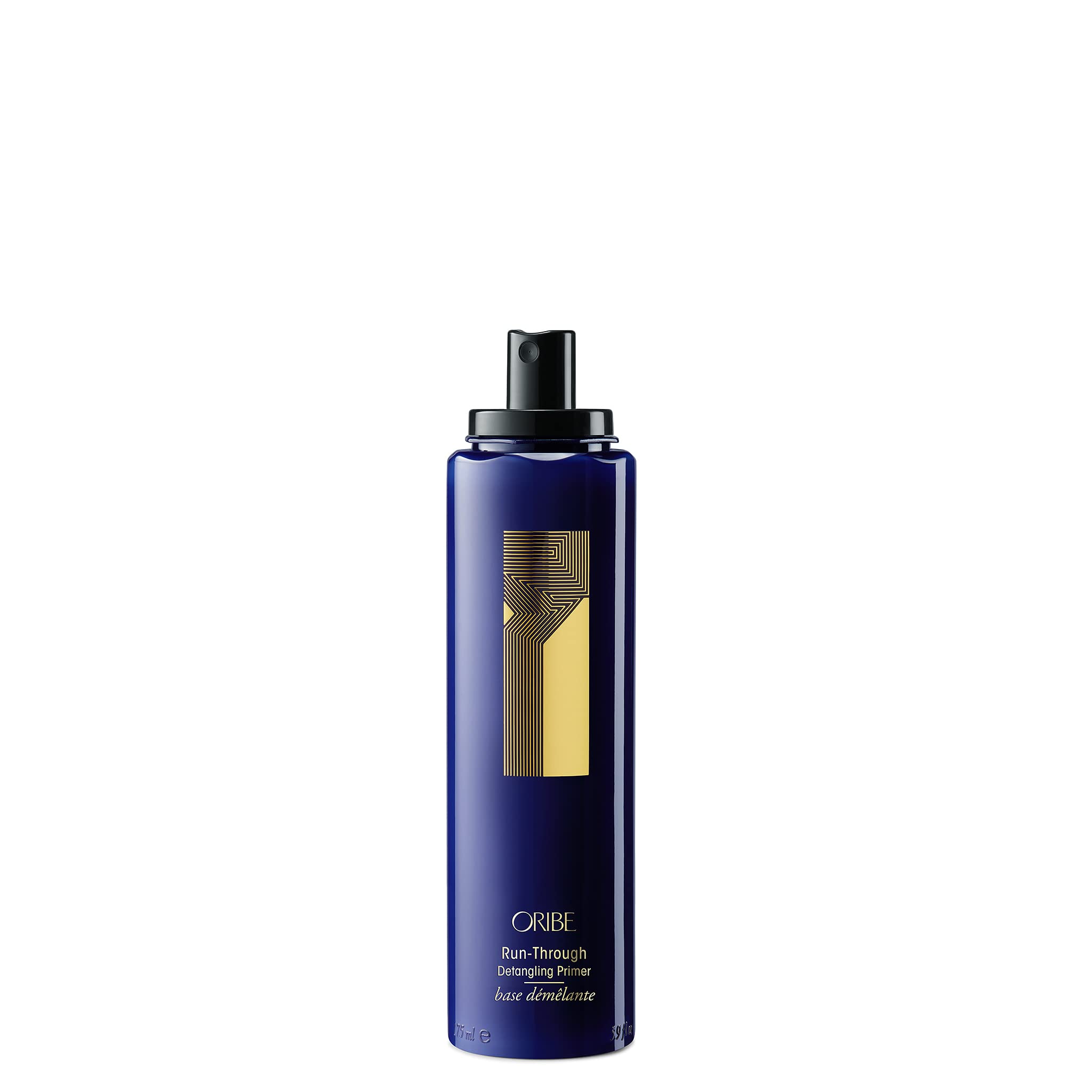 Oribe Run-Through Detangler spray in action for effortless detangling and smooth styling.