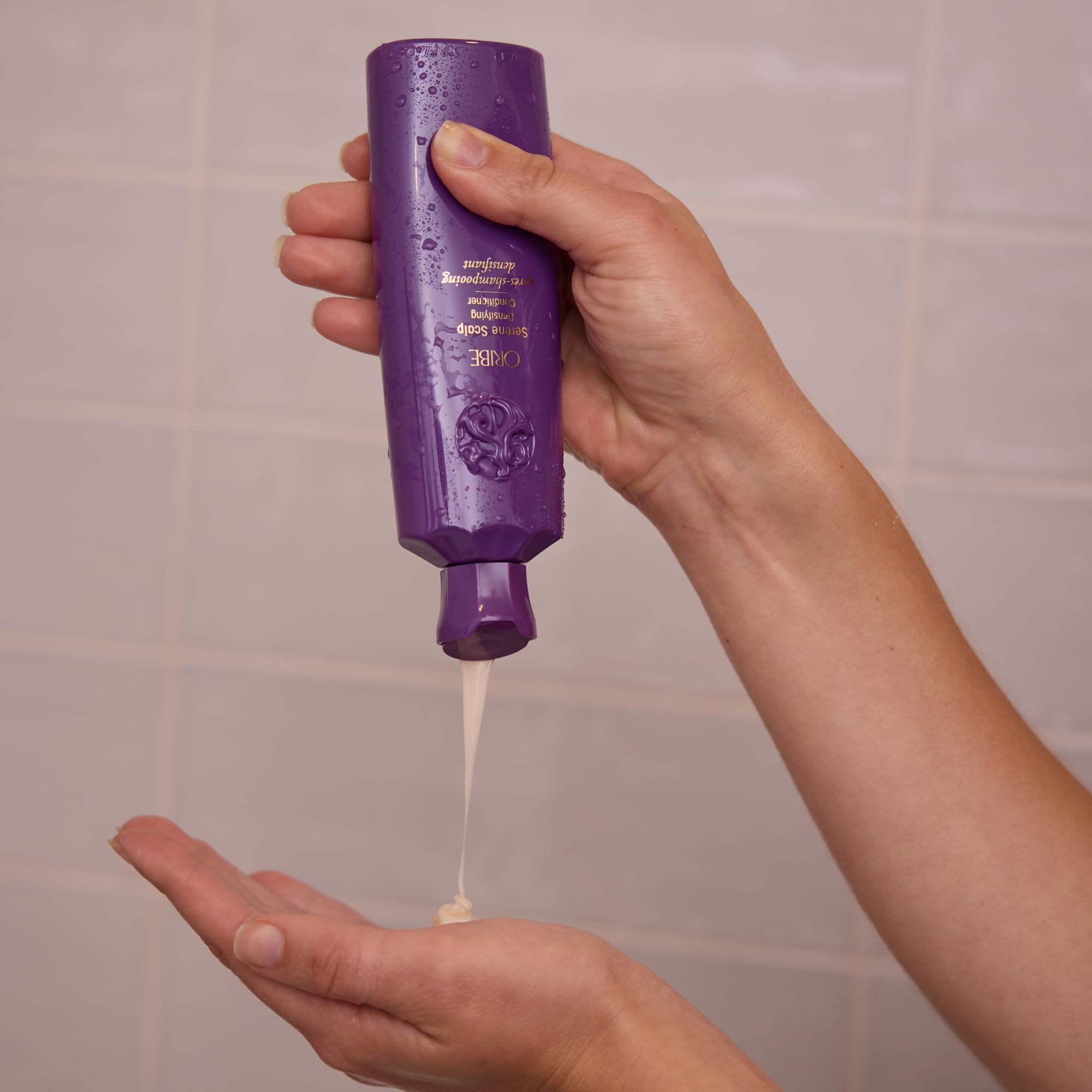 Close-up of scalp area associated with gentle care from Oribe Serene Scalp Densifying Conditioner.