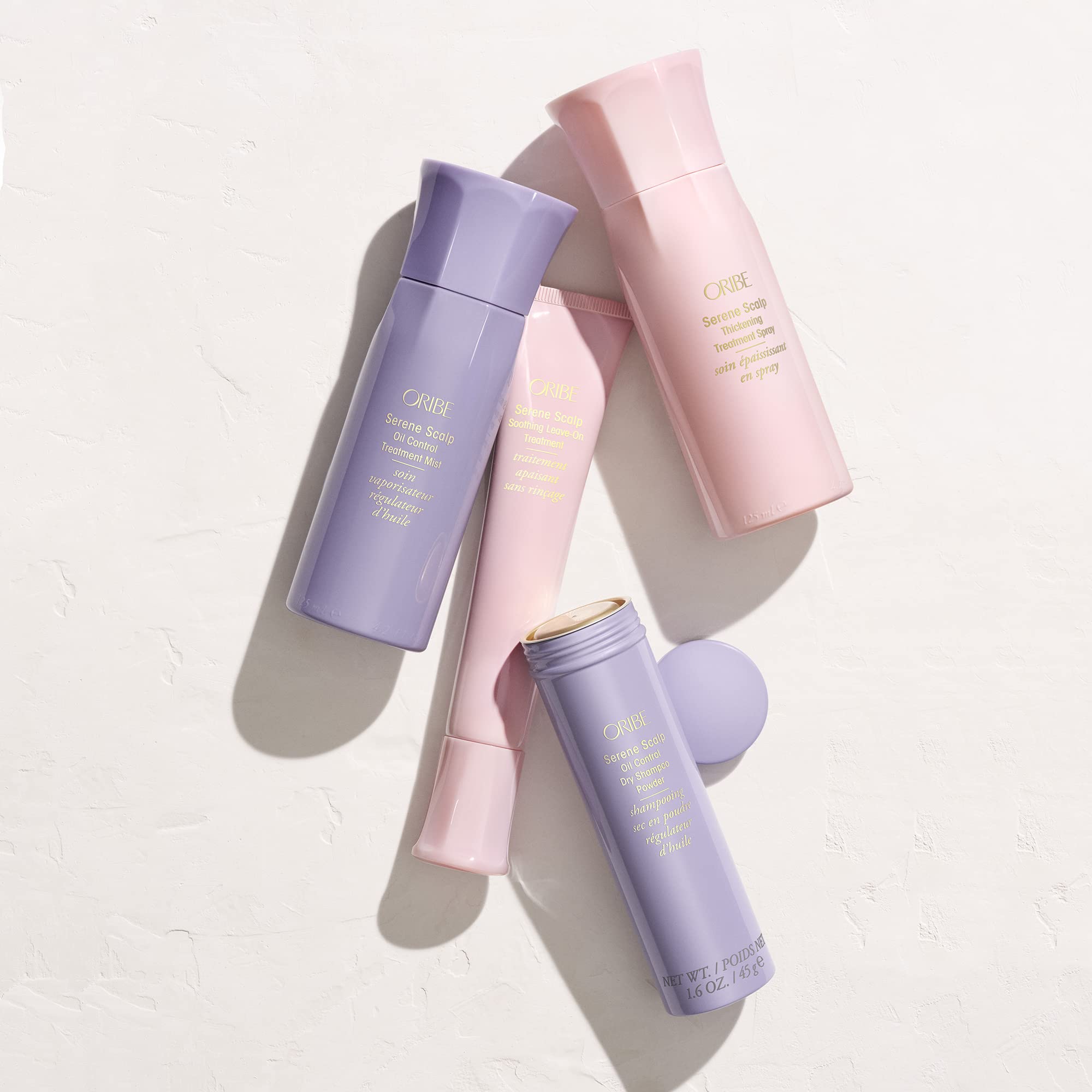 Oribe Serene Scalp Dry Shampoo Powder brush-on application detail.