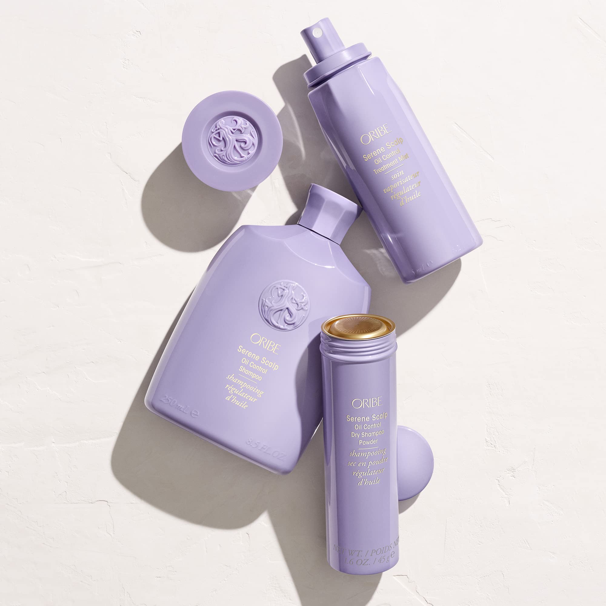 Oribe Serene Scalp Dry Shampoo Powder packaging with mango leaf extract badge.
