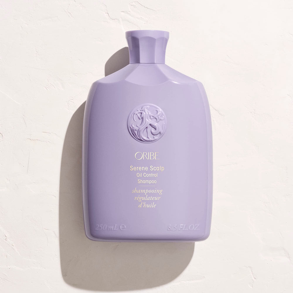 Oribe Serene Scalp Oil Control Shampoo dispensing top with lavender accent.