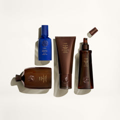 Oribe label close-up emphasizes paraben-free formula and UV protection.