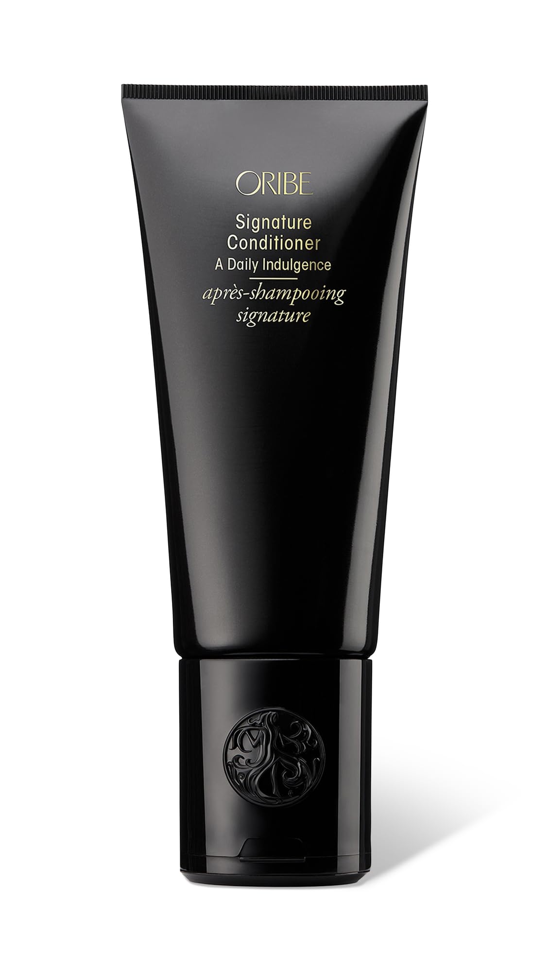 oribe signature conditioner bottle demonstrates luxurious hydration for silky, manageable hair