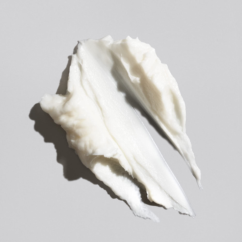 Oribe Signature Moisture Masque application scene shows smooth distribution through lengths.
