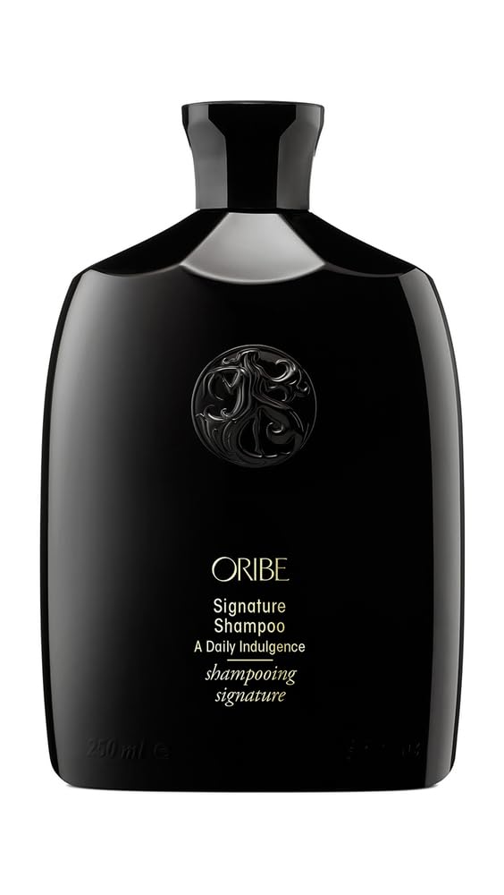 Oribe Signature Shampoo bottle delivers luxurious daily cleansing for silky hair.