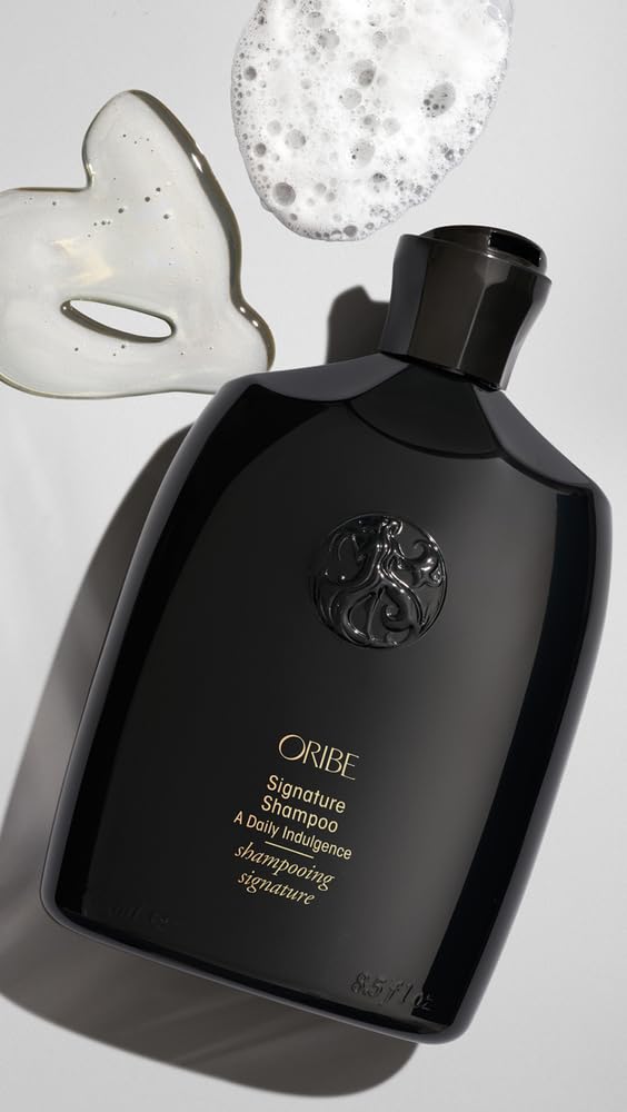 Oribe Signature Shampoo packaging on shelf emphasizes premium care.