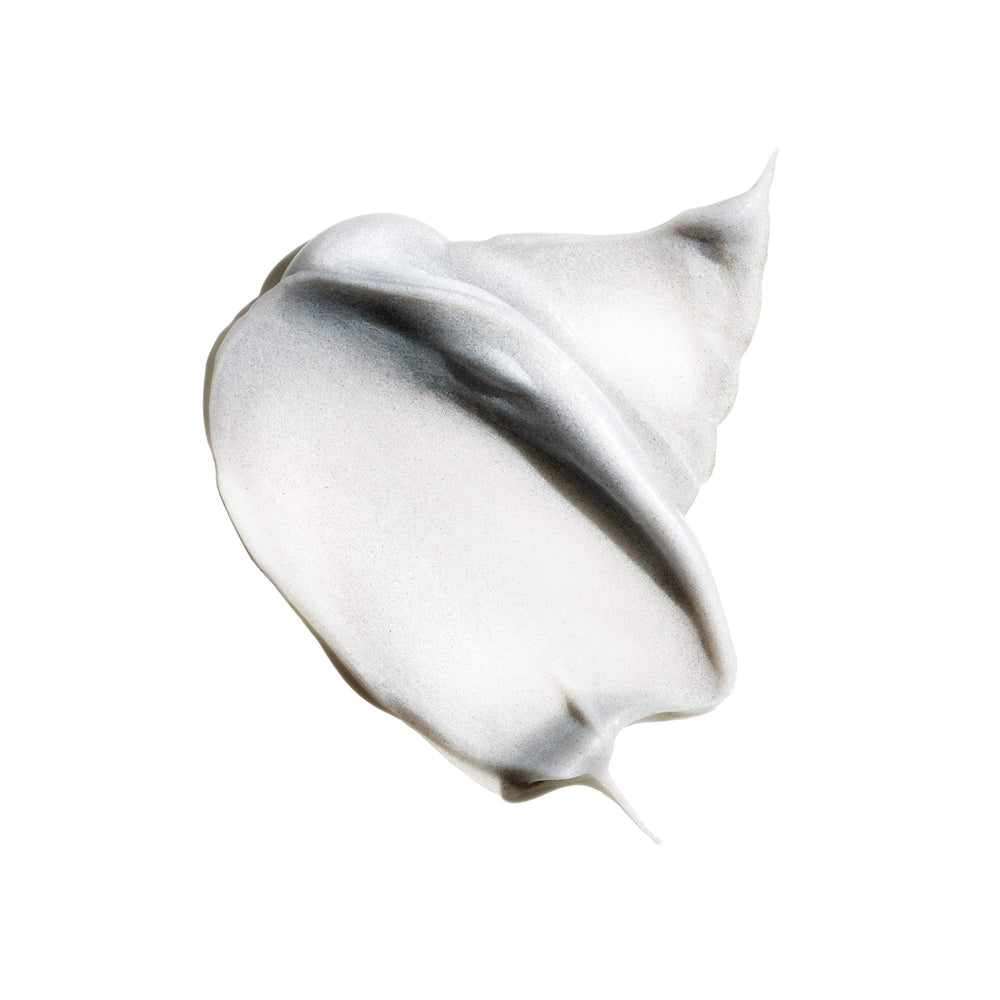 Oribe Silverati bottle with pump demonstrates easy detangling and application.