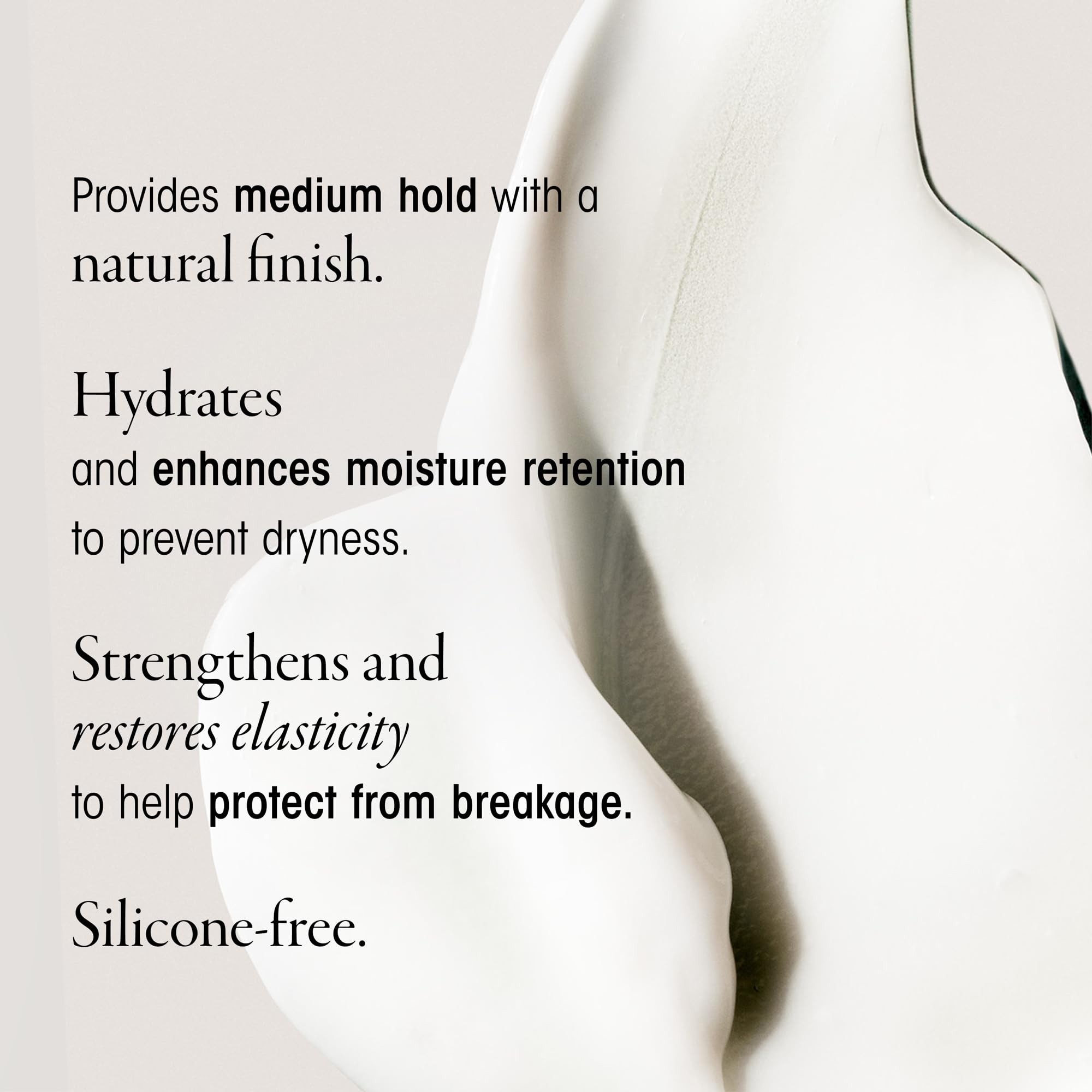 Hands apply Oribe Creme to control frizz and boost softness