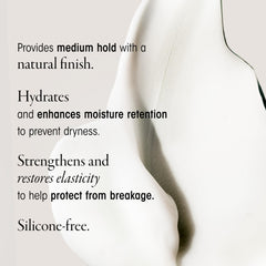 Hands apply Oribe Creme to control frizz and boost softness