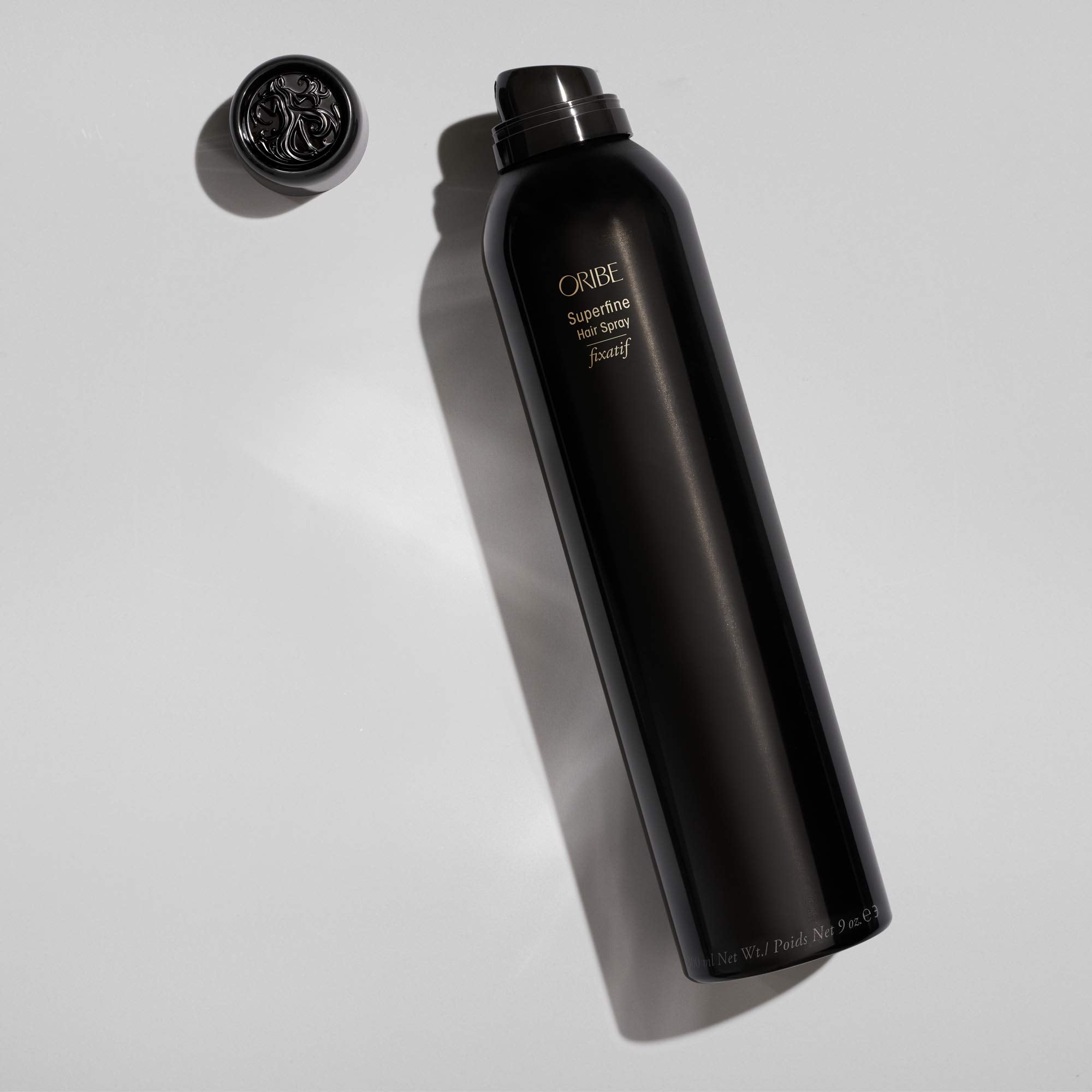 Oribe Superfine Hair Spray application-pattern shows feather-light spray for easy use.