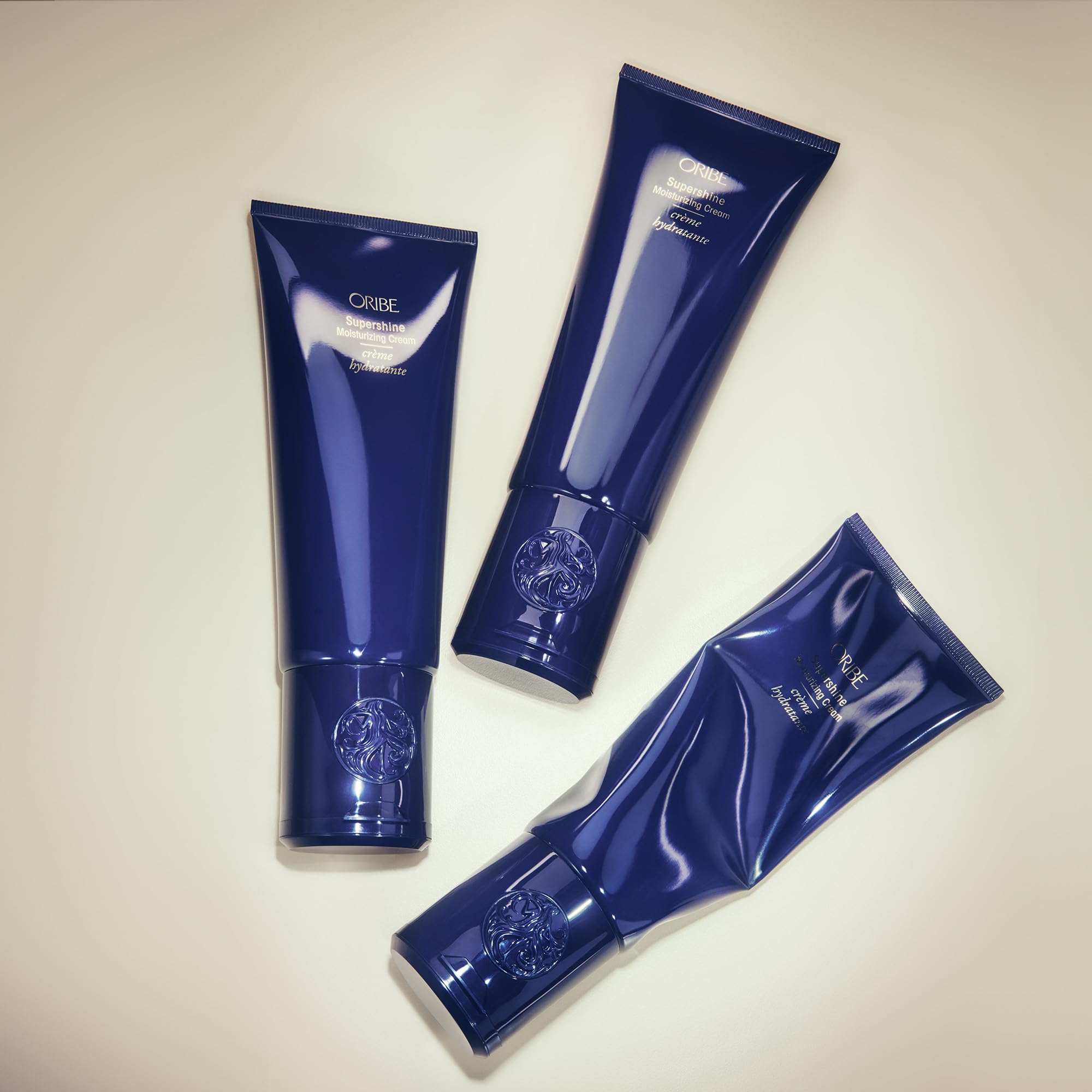 Oribe Supershine Cream packaging with bottle and box