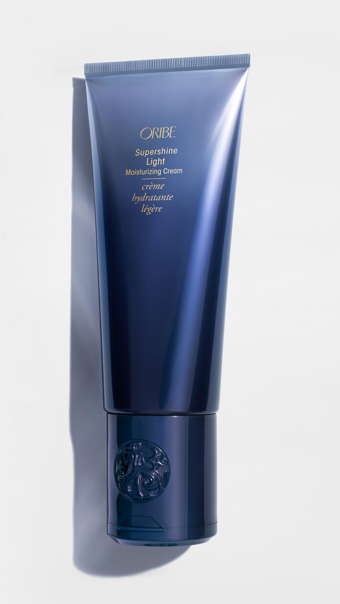 Oribe Supershine hands-apply-cream shows easy, smooth application.