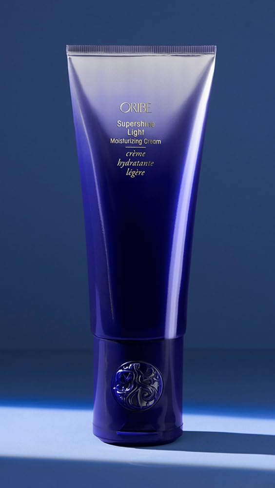 Oribe Supershine heat-protection during blow-dry demonstrates safeguards.