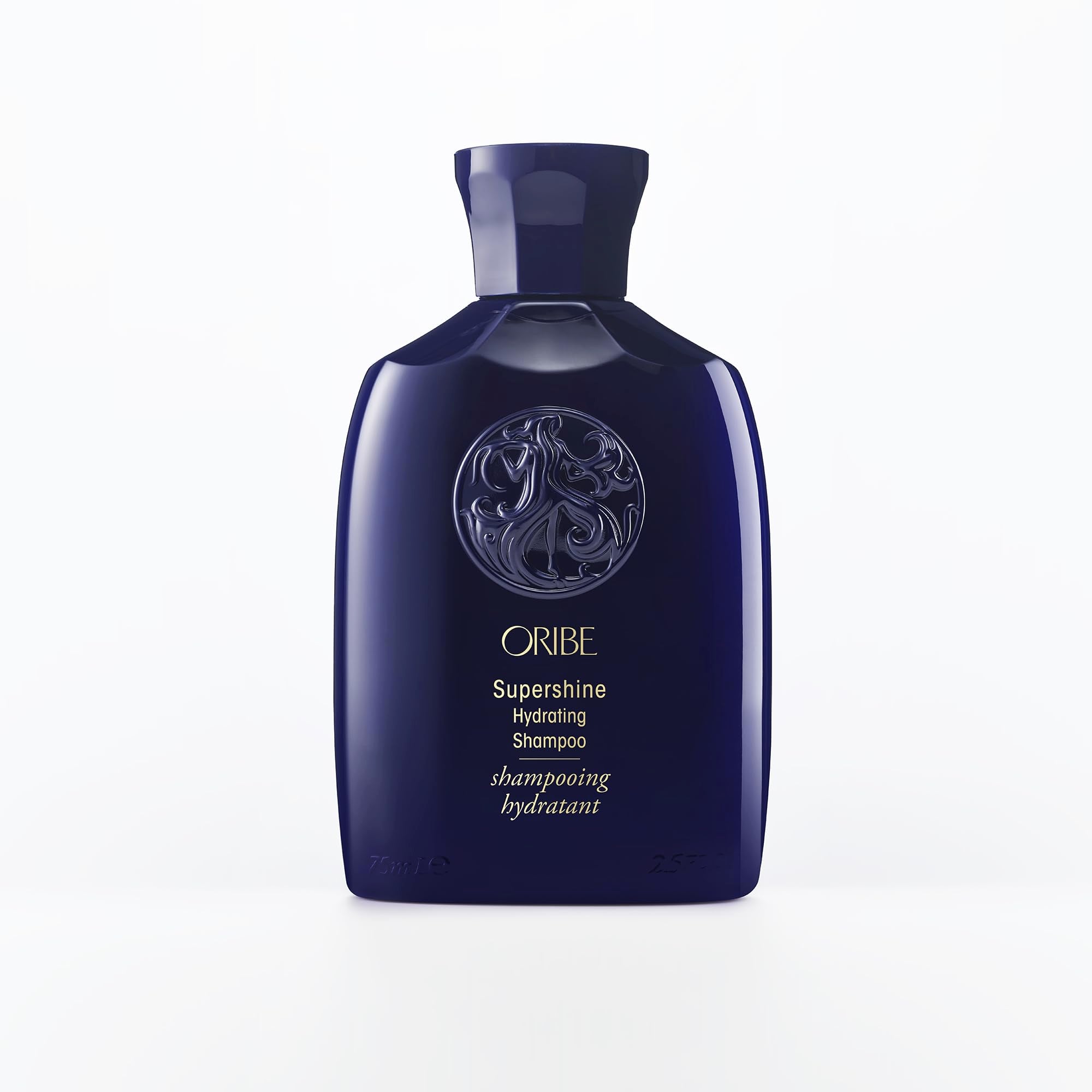 Oribe Supershine Hydrating Shampoo travel size bottle pour showcases premium formula for radiant shine