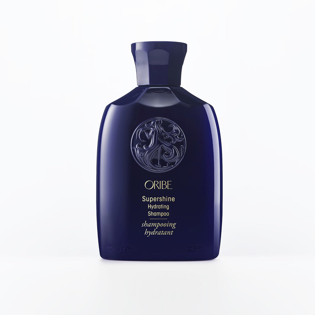 Oribe Supershine Hydrating Shampoo travel size bottle pour showcases premium formula for radiant shine