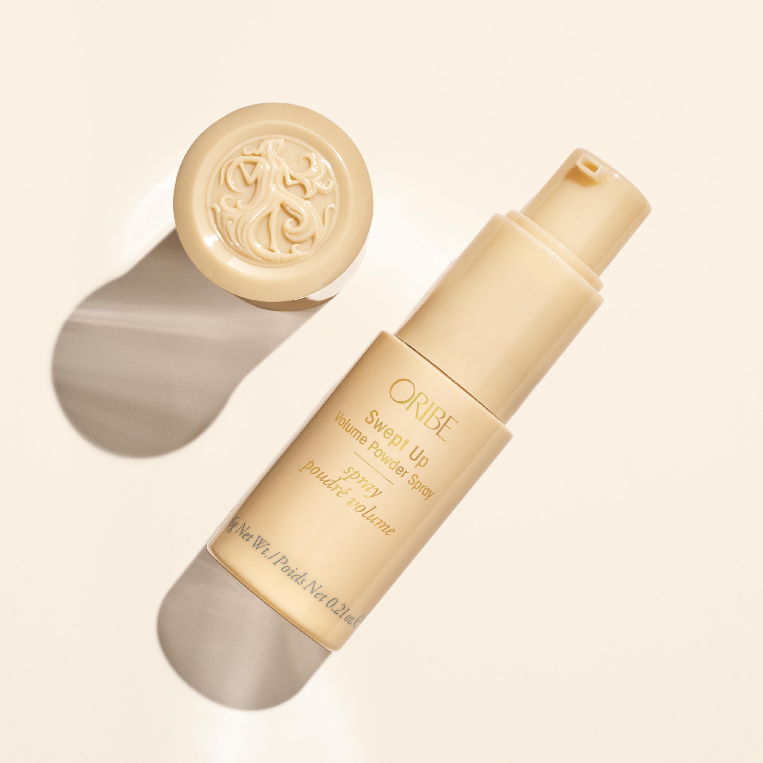 ORIBE Swept Up Volume Powder on finished updo showing dramatic volume and semi-matte texture.