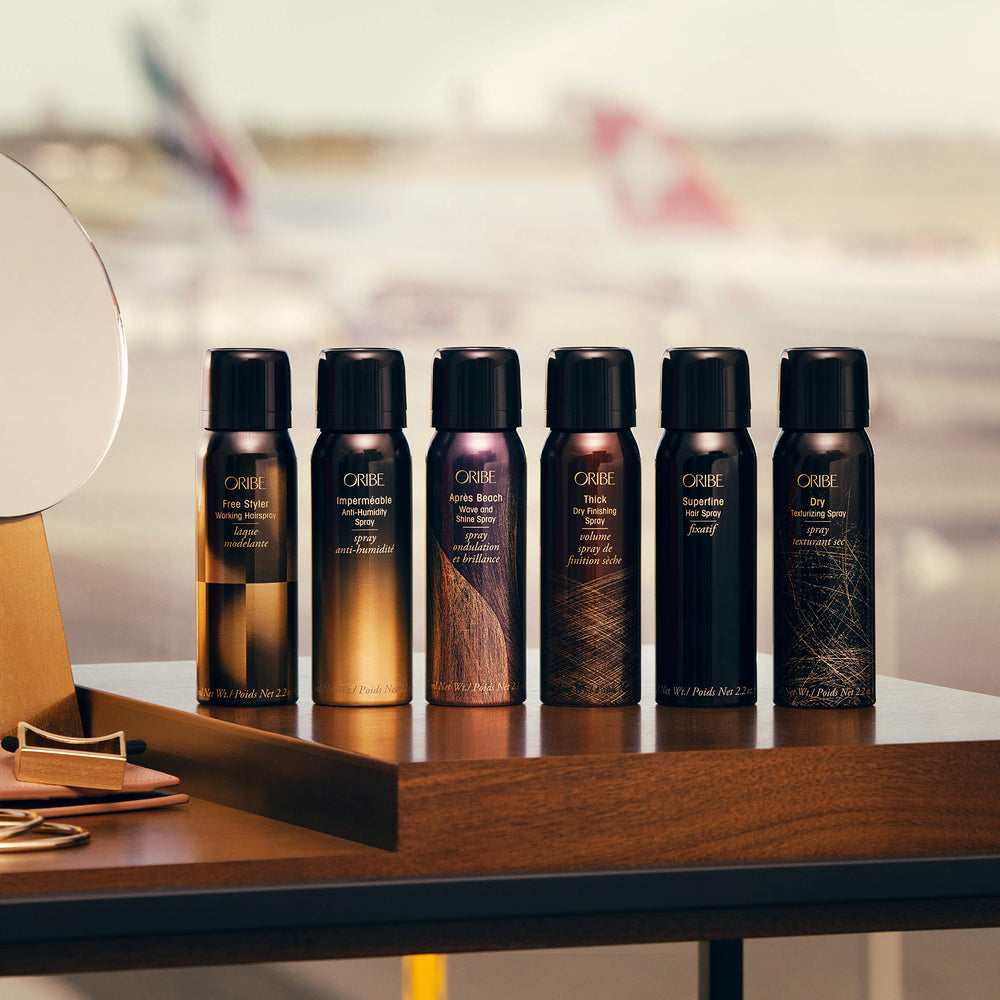 Oribe Thick Dry Finishing Spray mist on hair for lift