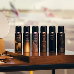 Oribe Thick Dry Finishing Spray mist on hair for lift