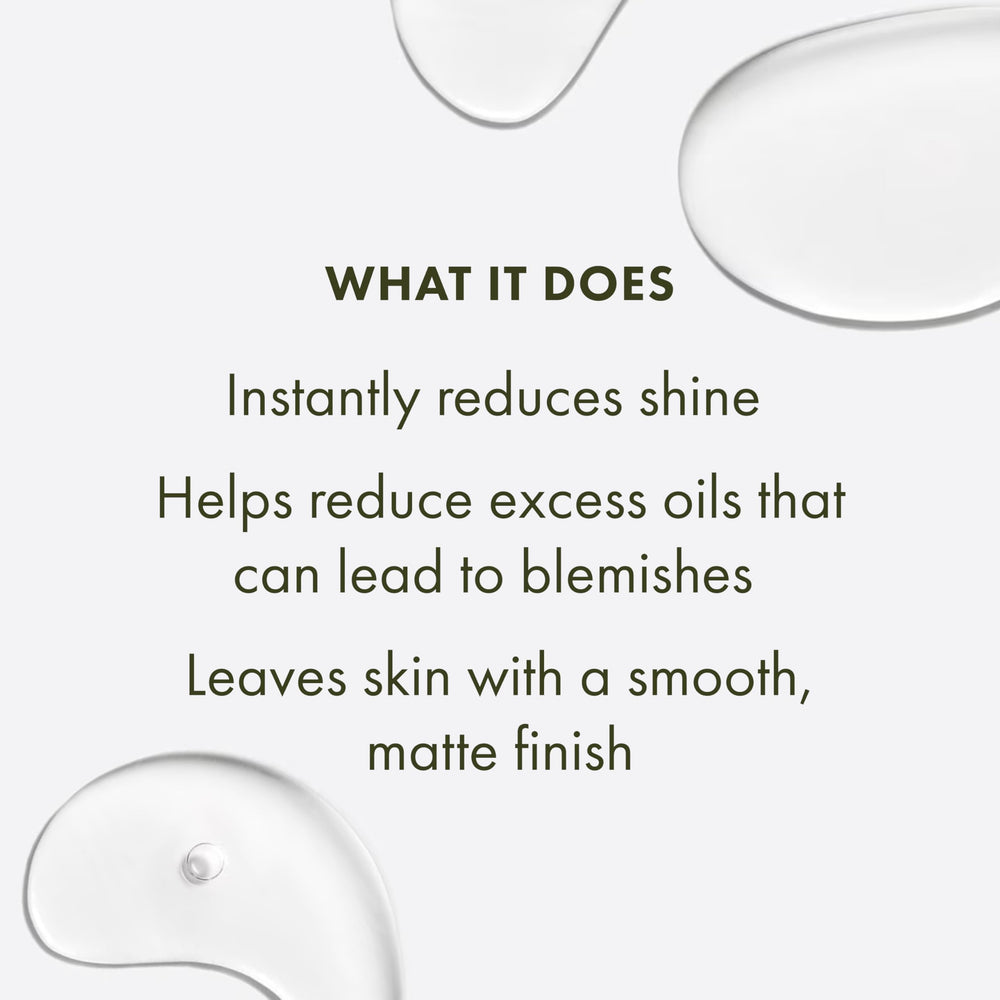 Cotton pad applying Origins Clear Improvement toner to face.