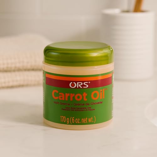 ORS Carrot Oil Hair Cream label closeup emphasizes beta-carotene and nettle for hair protection
