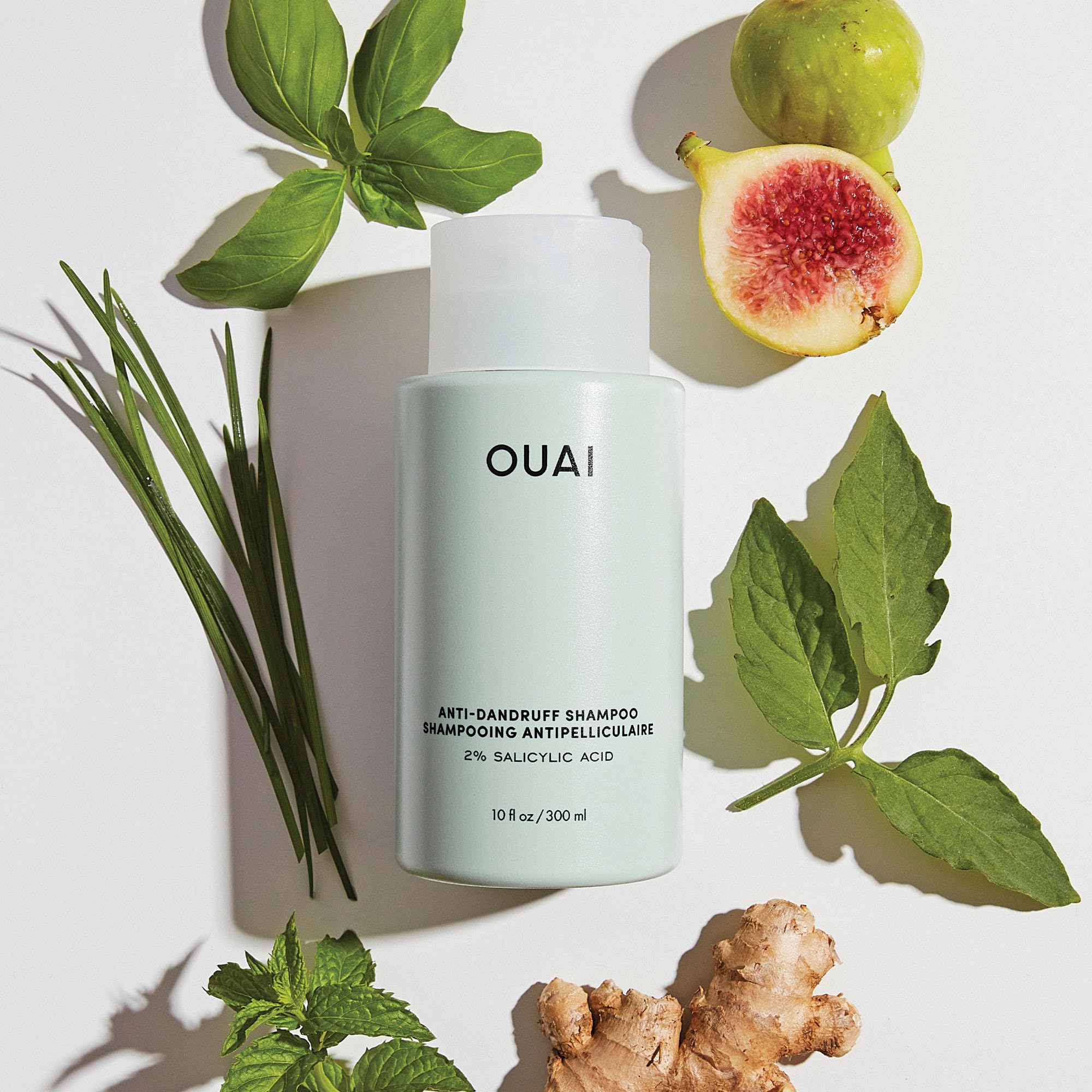 OUAI bottle packaging closeup underscores premium yet affordable scalp care.
