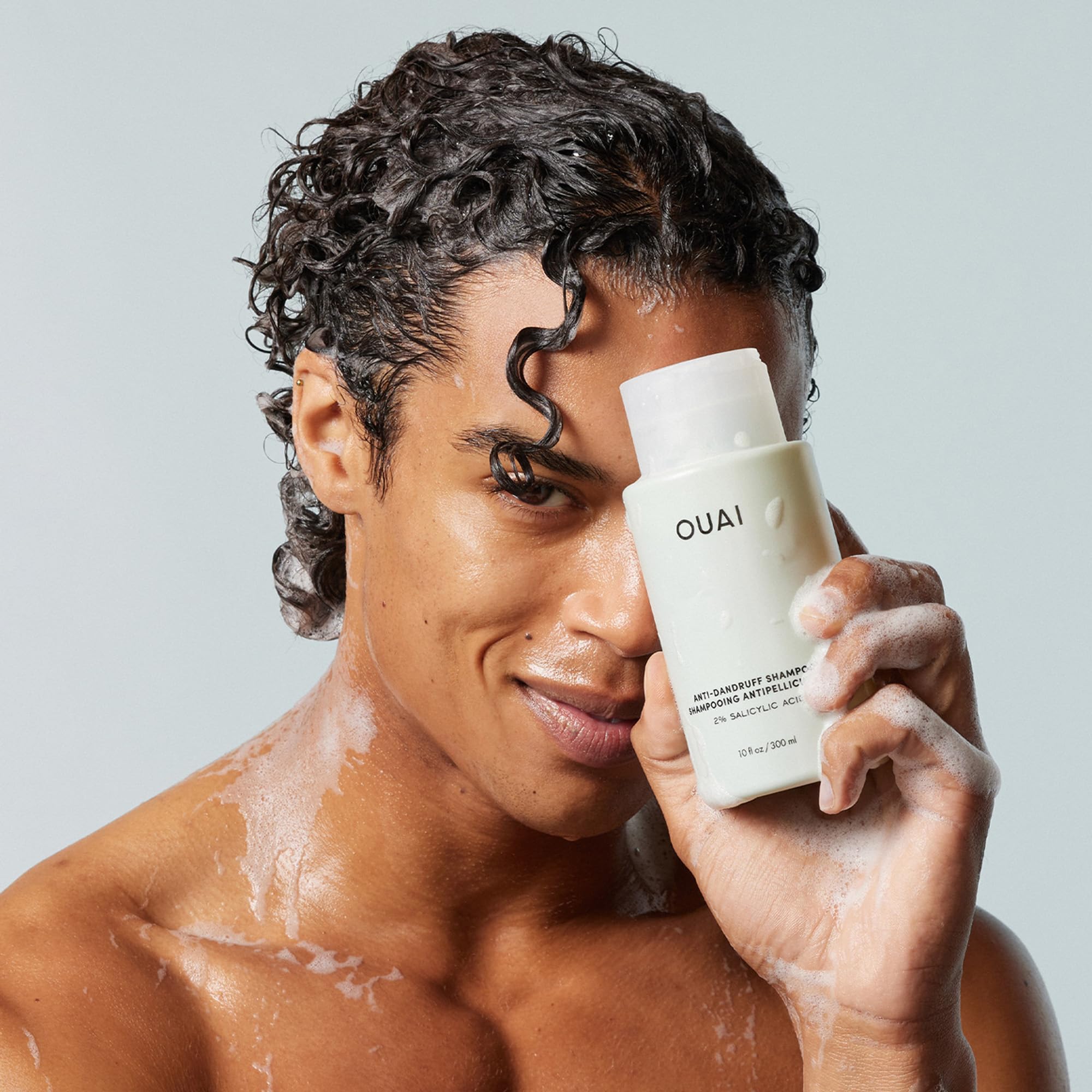 OUAI shampoo rinse image emphasizes thorough cleansing without drying hair.