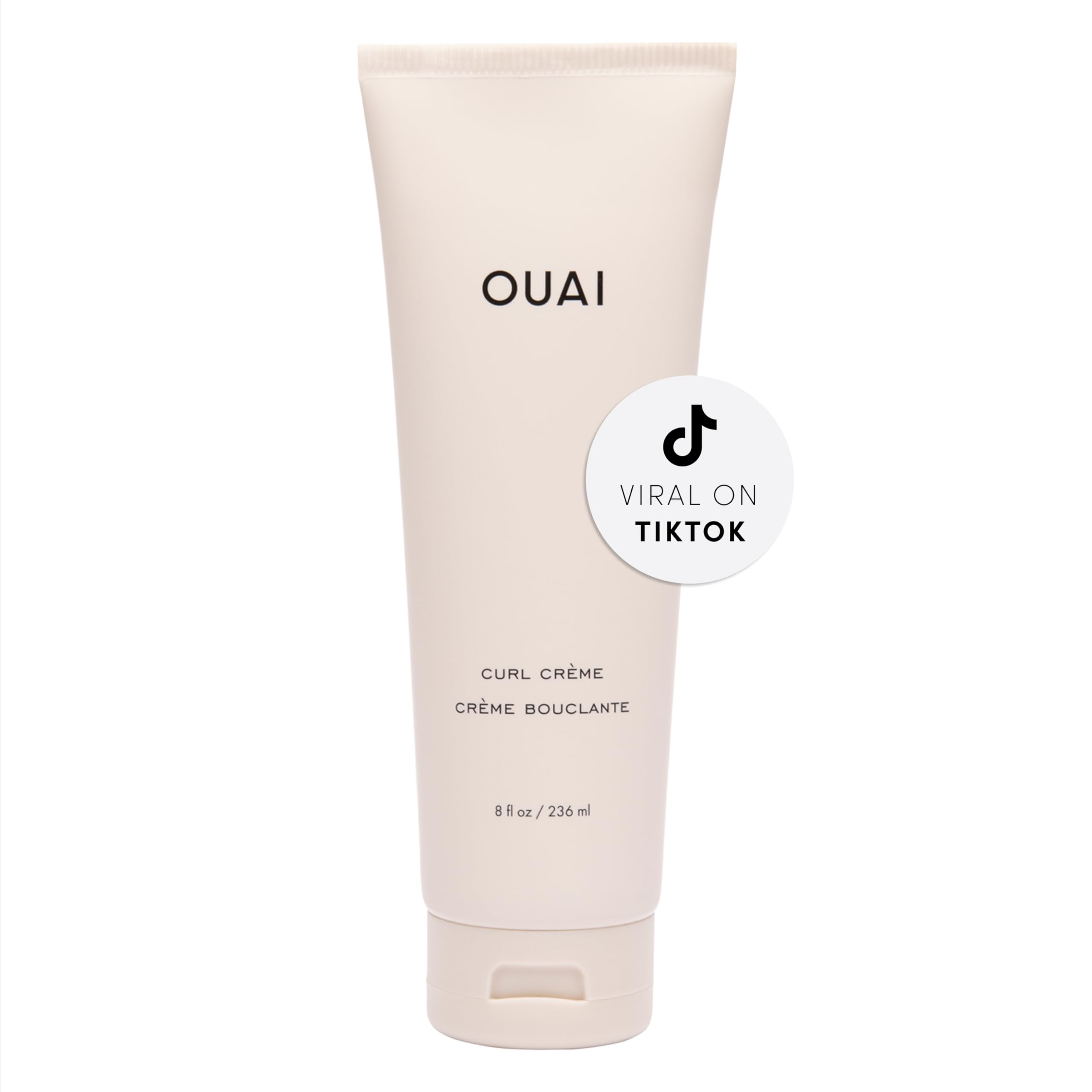 OUAI Curl Cream bottle front view showing defined, frizz-free curls.