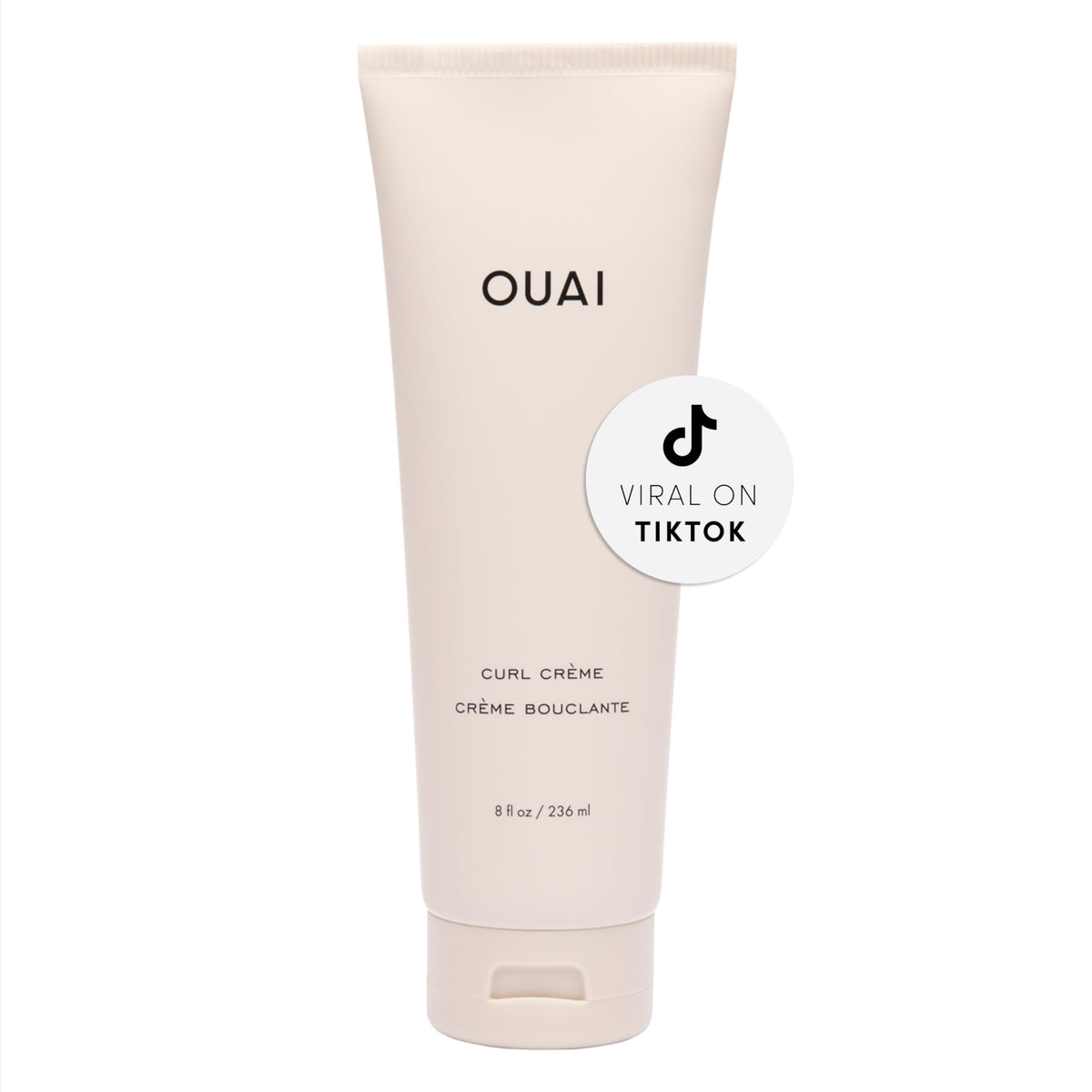 OUAI Curl Cream bottle front view showing defined, frizz-free curls.