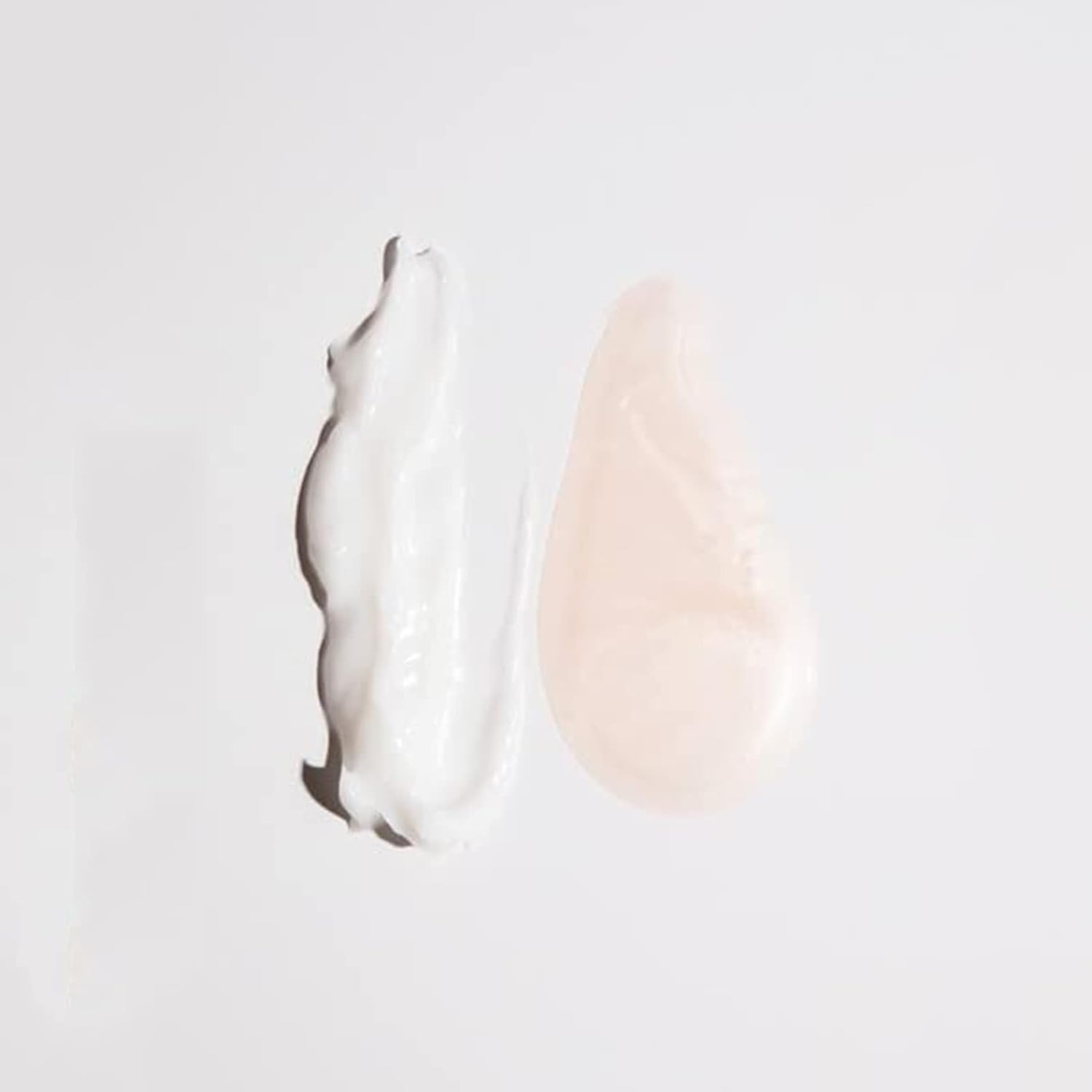 OUAI frizz-control closeup: tames flyaways for sleek, air-dried styles.