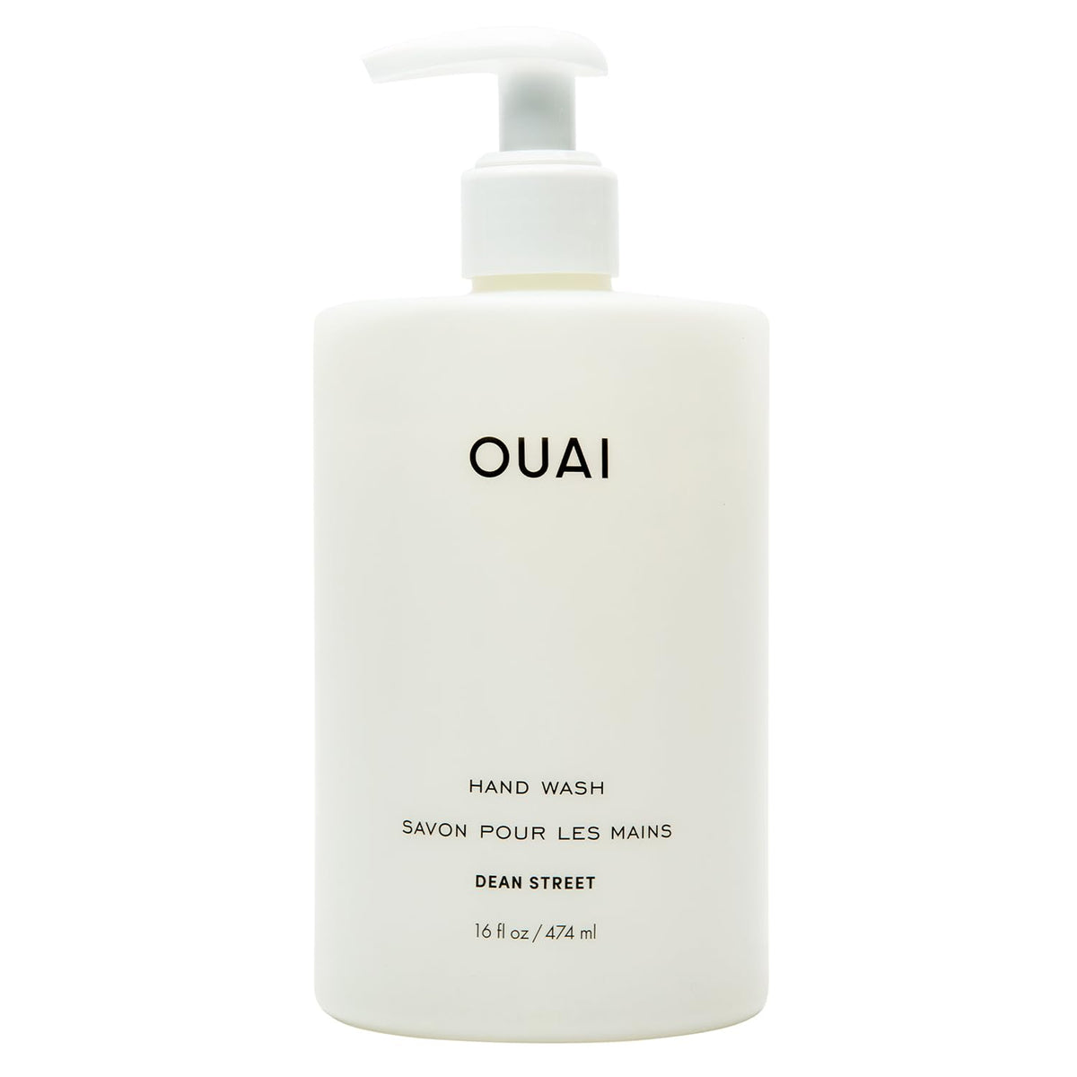 OUAI Hand Wash Dean Street bottle pour highlighting exfoliation and hydration.