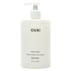 OUAI Hand Wash Dean Street bottle pour highlighting exfoliation and hydration.