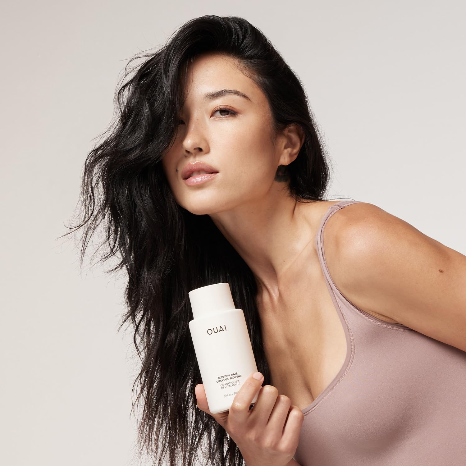 OUAI keratin-enriched conditioner close-up highlights shine and frizz control