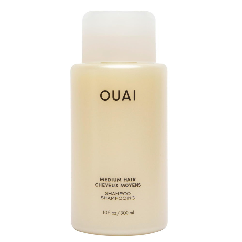 OUAI Medium Shampoo bottle on a clean shelf for daily nourishment.