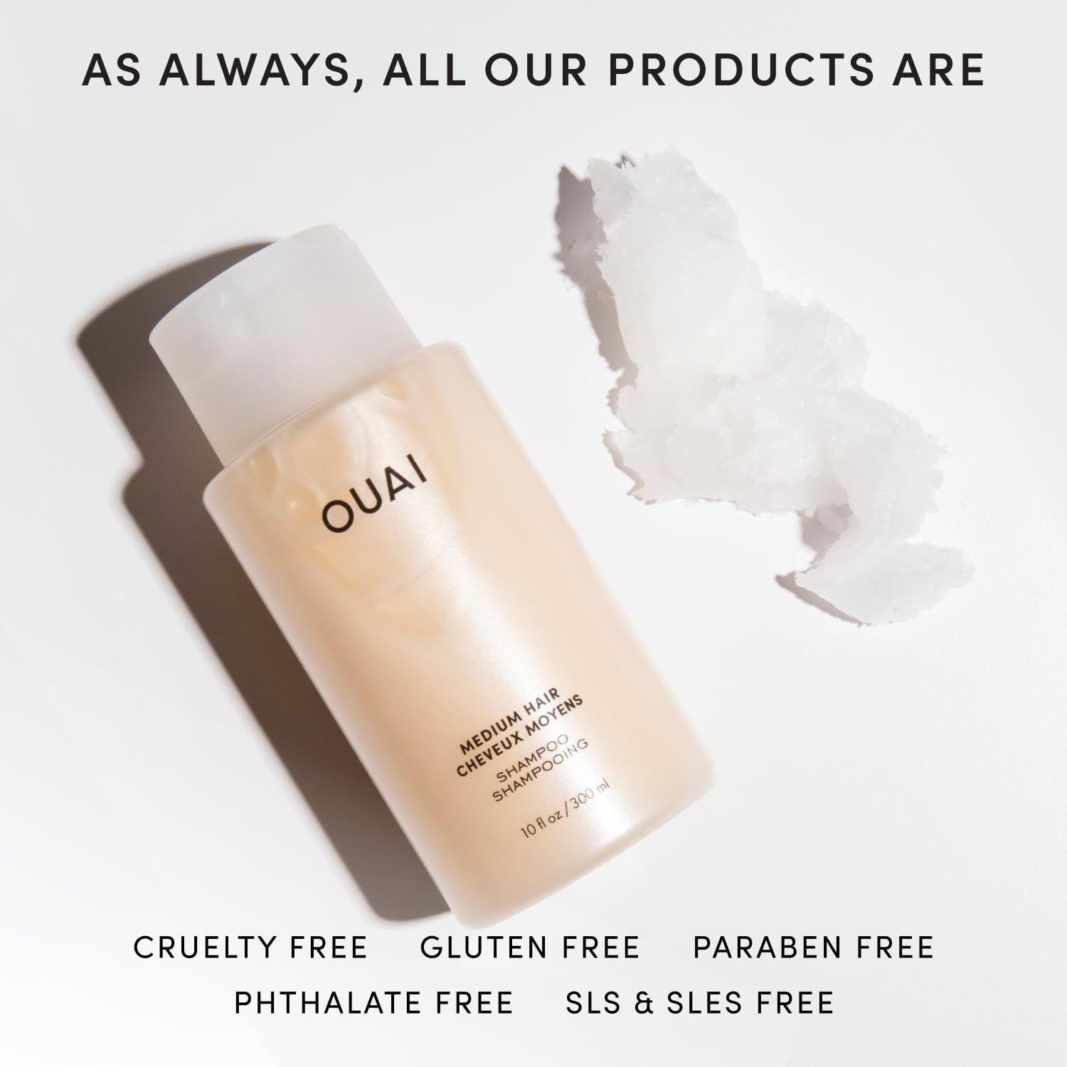 OUAI Medium Shampoo pump dispensing for easy, controlled use.