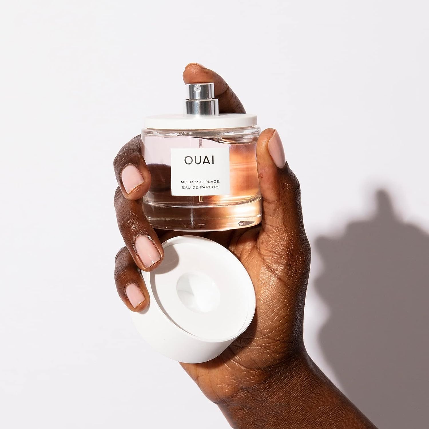 OUAI Melrose Place amber and cedarwood base conveys lasting warmth