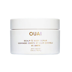 OUAI scalp and body scrub travel size bottle for on-the-go exfoliation.