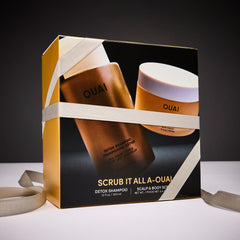 OUAI travel-size sugar scrub for body exfoliation and skin smoothing.